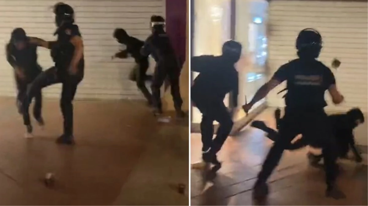 Fransa'da kaos hakim! Kalabalık küme mağazaları yağmalarken polise yakalandı